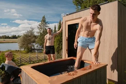 Step out of the warmth of the sauna into a tub beside it